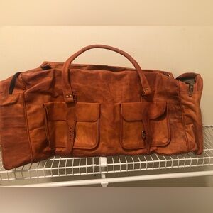 Large leather like duffel bag